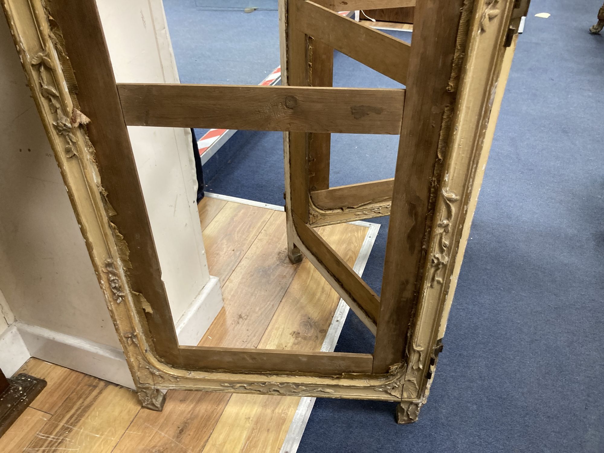 An early 20th century giltwood and gesso part glazed three fold dressing screen, height 172cm